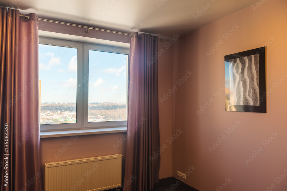 Fototapeta premium Interior of a new bedroom with a window and a picture on the wall