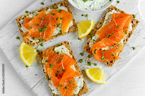 Принти на полотні Homemade Crispbread toast with Smoked Salmon, Melted Cheese and cress salad