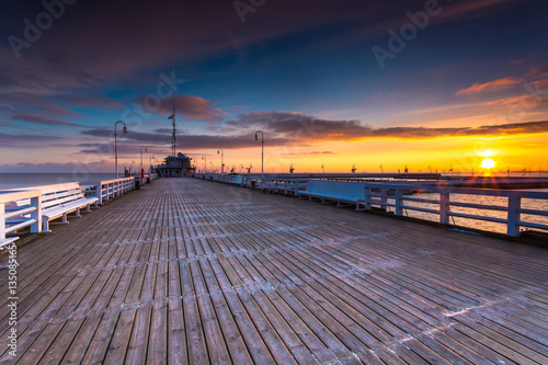 Cold morning  Pier in Sopot at sunrise with amazing colorful sky. Winter in Poland.