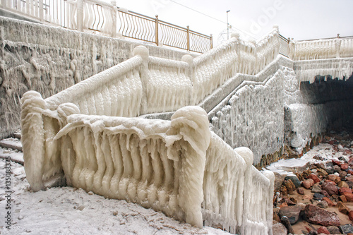 ice covered staircase on the beach photo