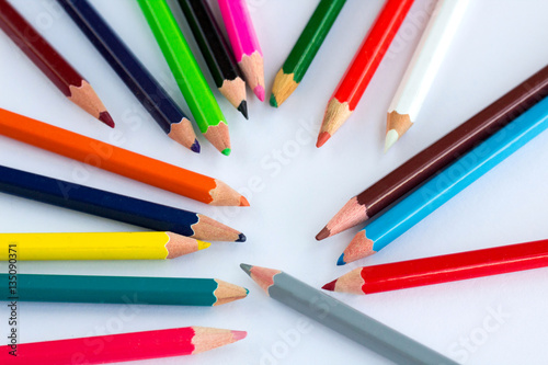 Colorful wooden pencils on white background with copy space