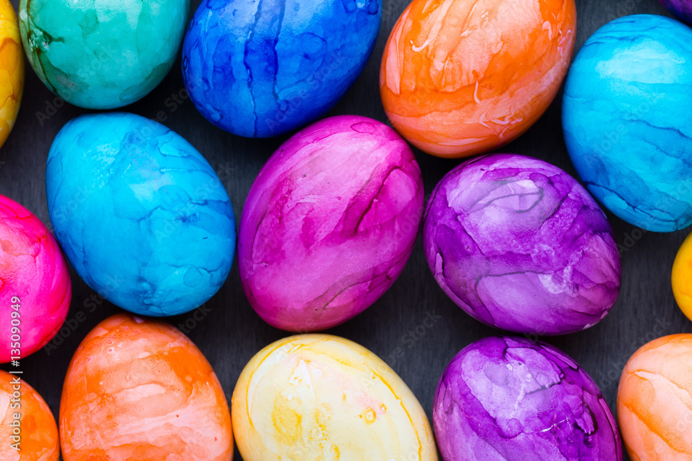 Easter eggs painted in colors on a pattern background. Easter eggs painted in colors on a pattern background.