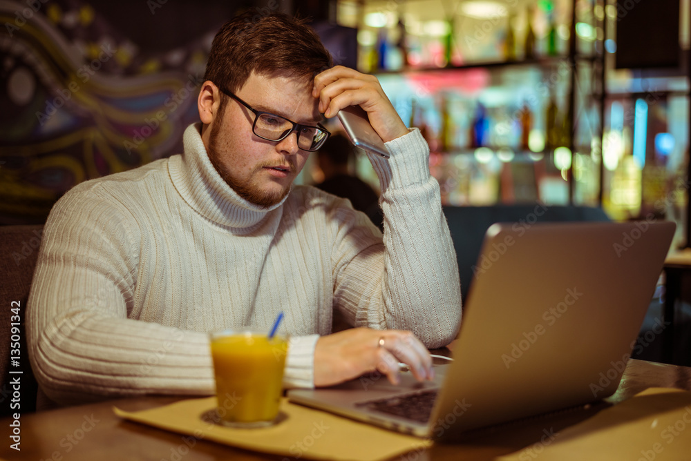 man looks depressed in cafe with laptop man looks depressed in cafe with laptop