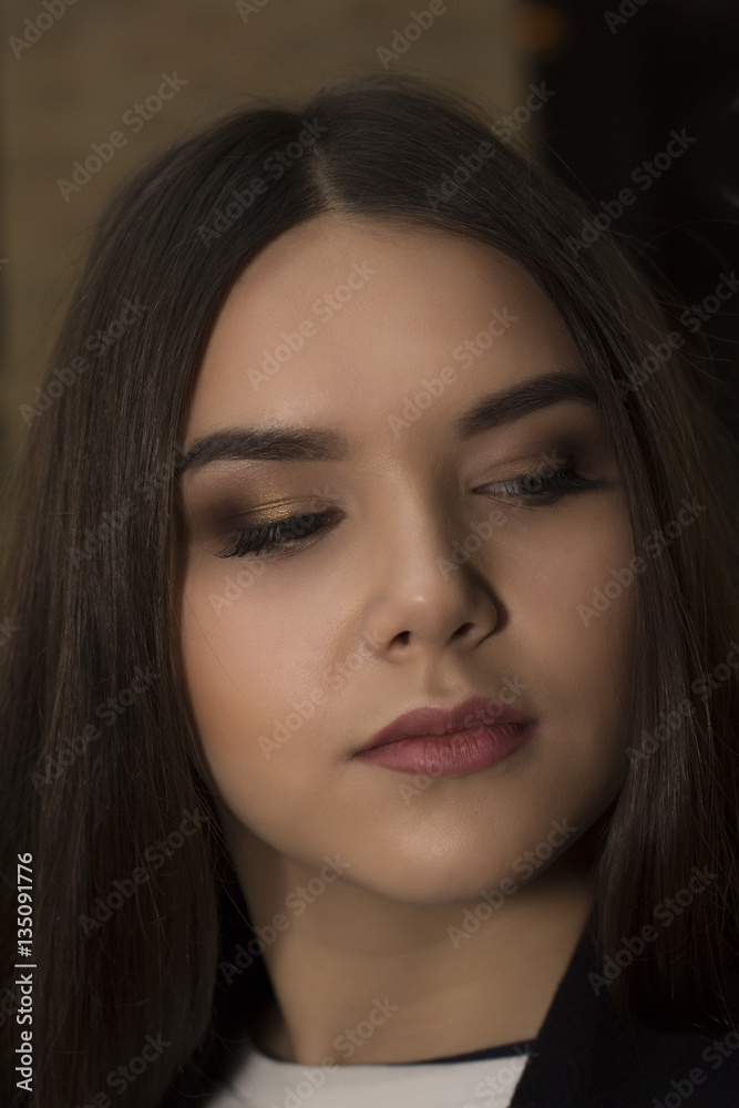 Beautiful brunette woman face with bright makeup. Closeup shot Beautiful brunette woman face with bright makeup. Closeup shot