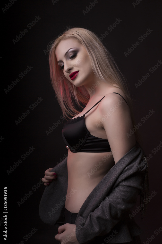 Fototapeta premium Luxurious young model with bright makeup and in black lingerie