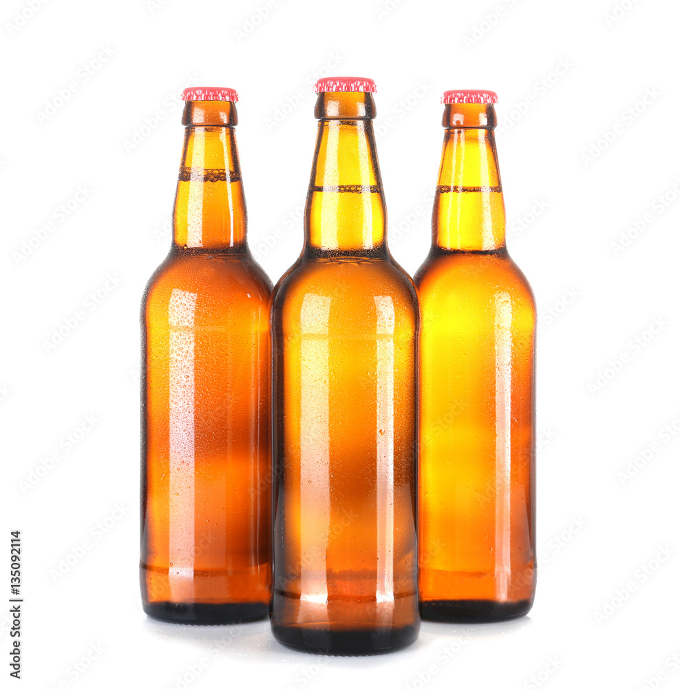 Beer bottles in a row isolated on white