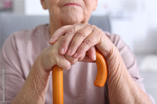 Elderly woman with walking ...