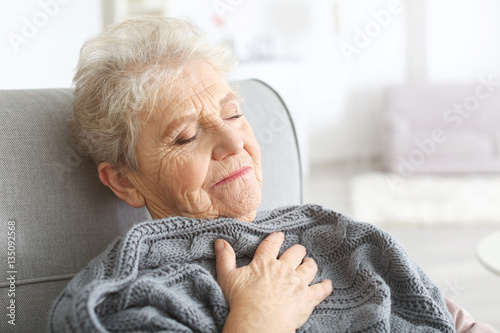 Depressed elderly woman at ...
