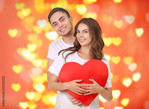 Young couple with heart pos...