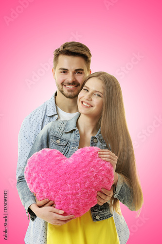 Young couple with heart pos...