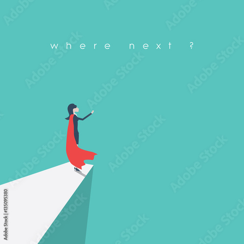 Superhero businesswoman standing on a cliff as a symbol of leadership, inspiration, strength, courage. Female emancipation and empowerment symbol.