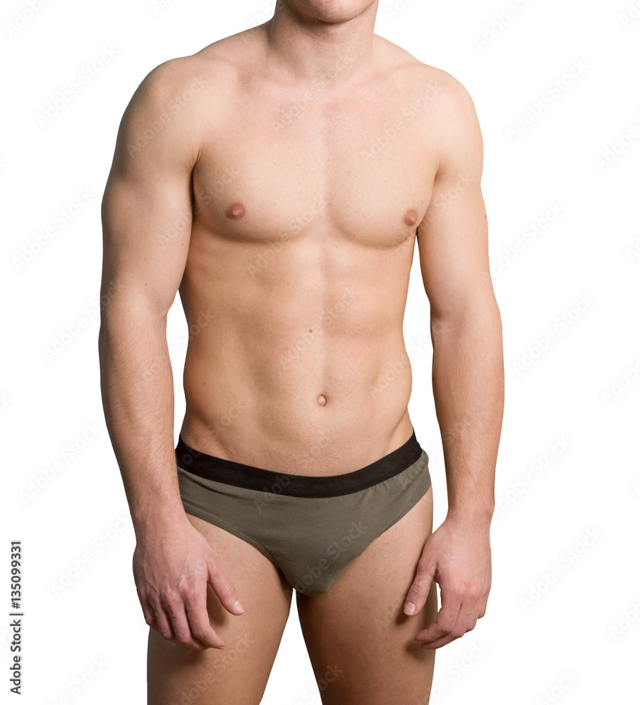 Torso of a young hairless man wearing briefs over white background