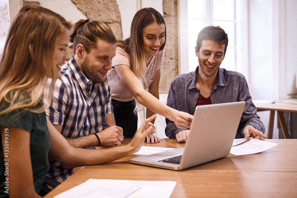 Professional team looking at a presentation Professional team looking at a presentation