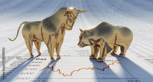 Goldener Bulle und Bär auf Börsenkursen photo