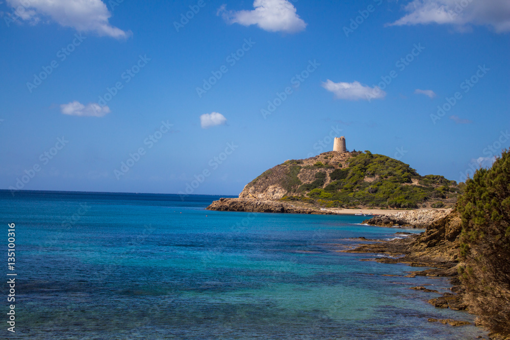 Italy Sardinia Torre di Chia bay with blue sky