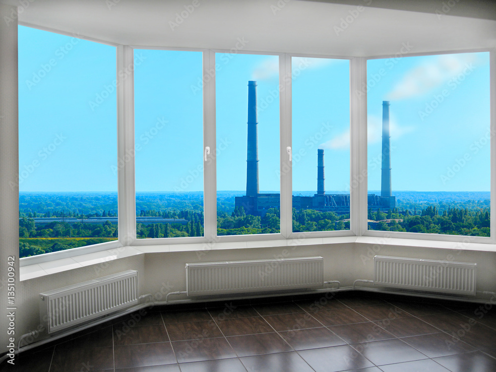 wide window with view to the landscape with nature and pollution of ...