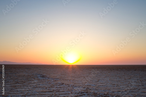 Sunset on Namak Salt Lake, in Maranjab desert, near Kashan, Iran. photo