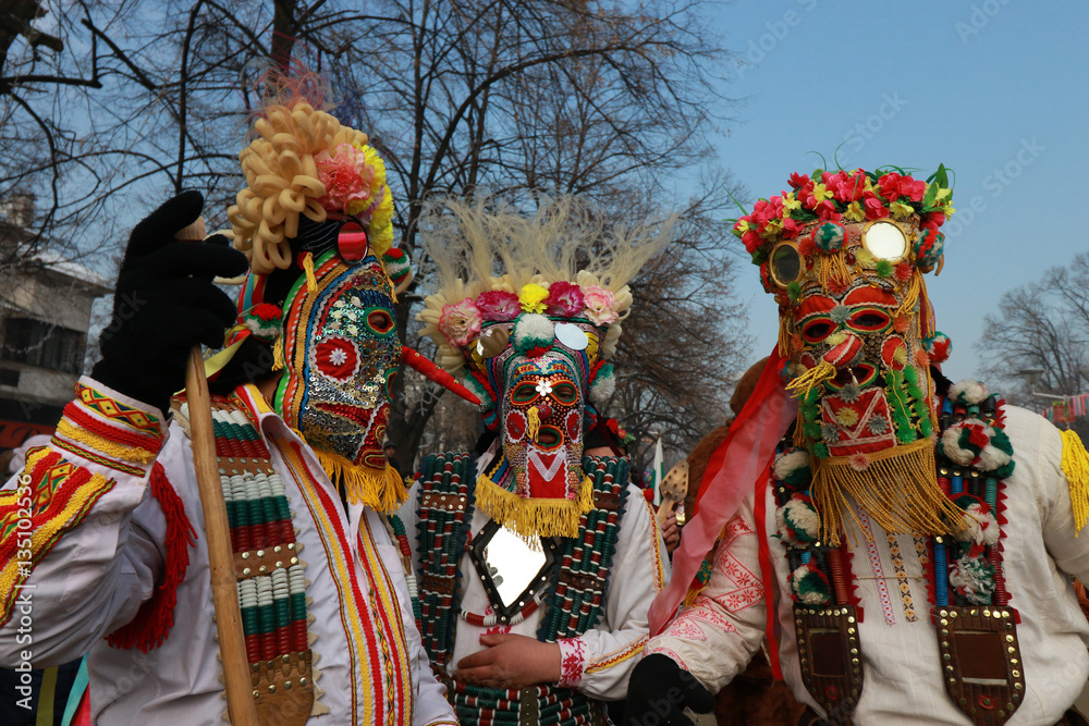 Fototapeta premium PERNIK, BULGARIA - JANUARY 29, 2017 - Masquerade festival Surva in Pernik, Bulgaria. People with mask called Kukeri dance and perform to scare the evil spirits