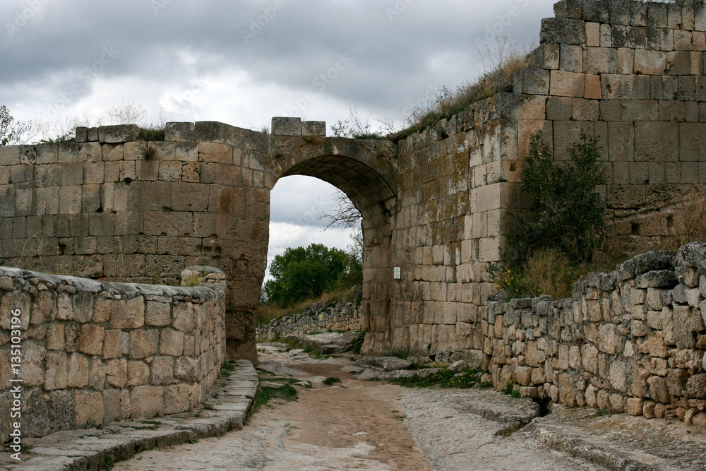 The city gate in the medieval cave city Chufut-Kale near Bakhchisarai, Crimea