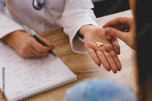 Doctor giving medicine to patient