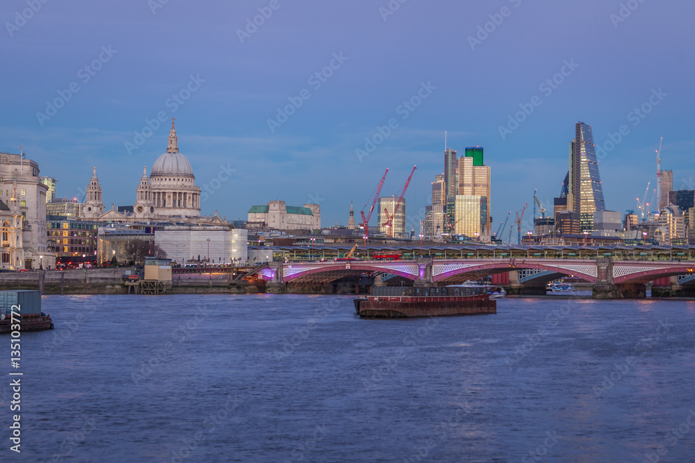 dusk in London with river Thames, St Paul Cathedral and skyline