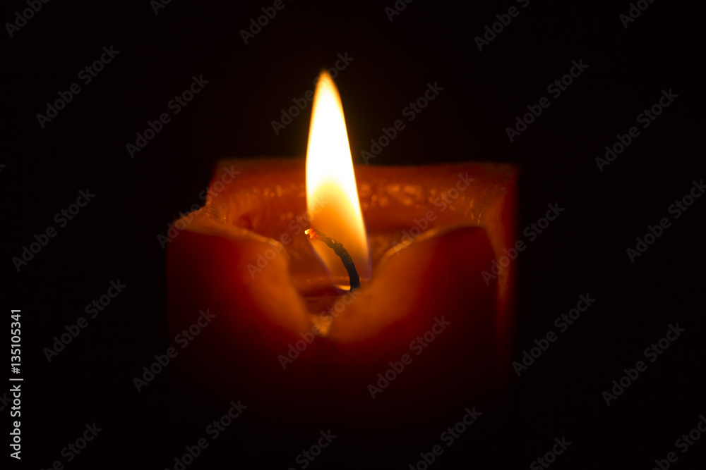 warm color candle flame on black background isolated warm color candle flame on black background isolated