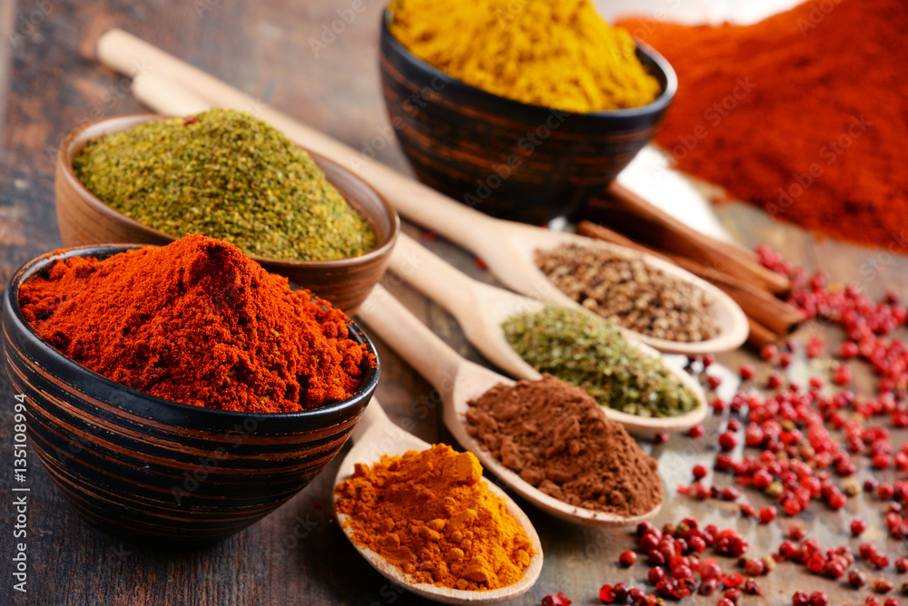 Variety of spices on kitchen table Variety of spices on kitchen table