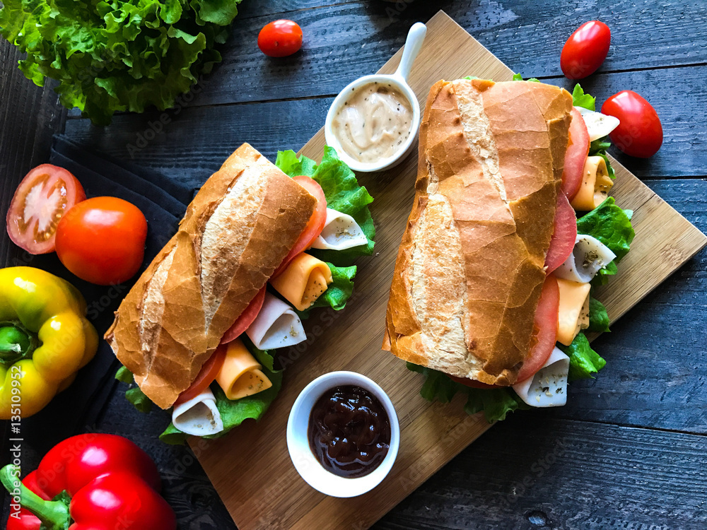 Delicious and Tasty sandwiches with turkey, ham, cheese, tomatoe
