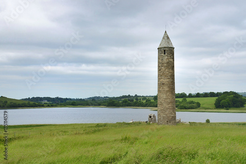 A twelfth century tower on Devenish Island which was part of a monastery. Near Enniskillen in Northern Ireland, the island is one of many on Lough Erne and is visited daily by hundreds of tourists