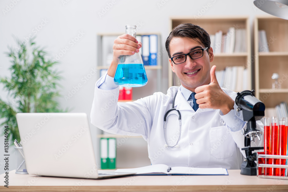 Man doctor working in the lab Man doctor working in the lab