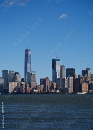 A skyline of New York City with the new iconic skyscraper at one world trade center.