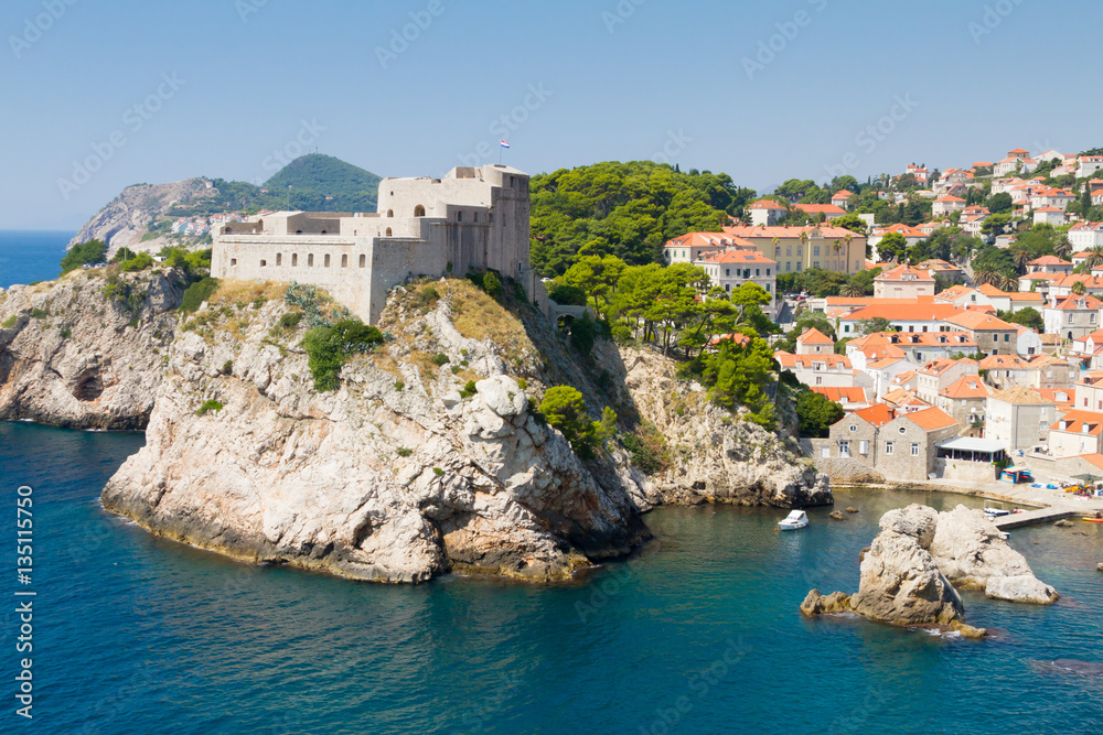 Walled fortress of Dubrovnik and rocky cliff
