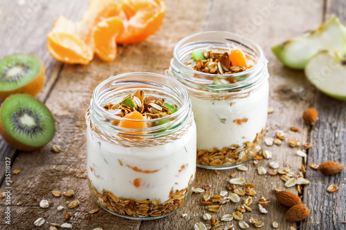 Healthy meal made of granola, yogurt and fruits. Delicious food for breakfast. Traditional American snack.