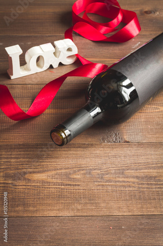 concept Valentine Day with wine at wooden background