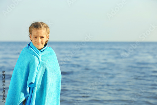 Cute girl wrapped in towel ...