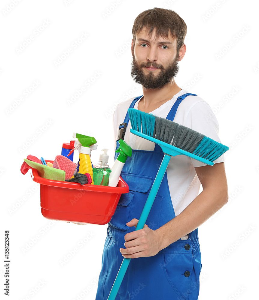 Young man with cleaning supplies on white background Young man with cleaning supplies on white background