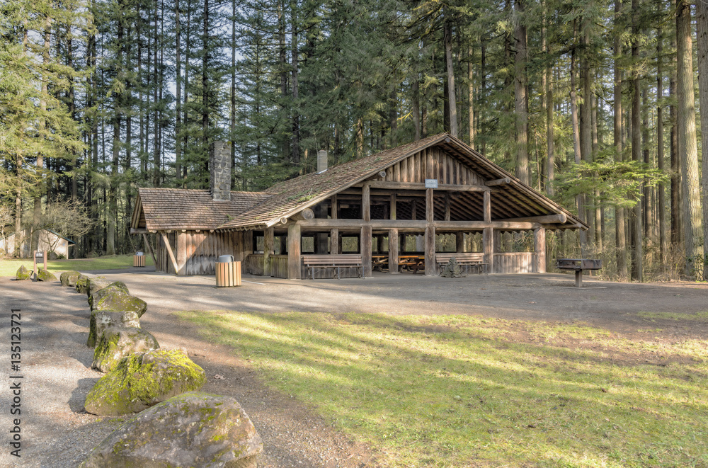 Large covered picnic shelter in a park.