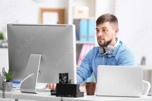 Handsome young programmer w...