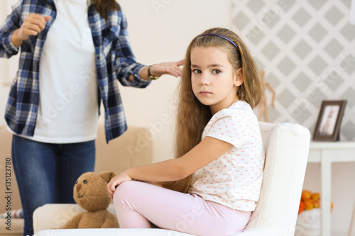Mother abusing sad little g...