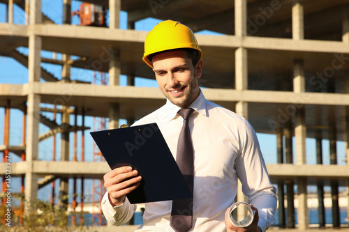 Handsome engineer with draw...