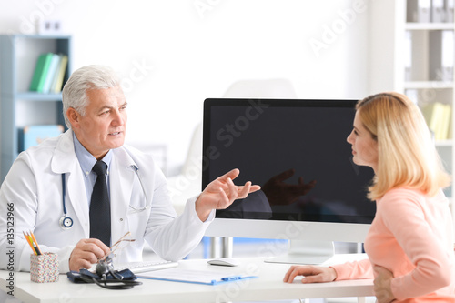 Young woman consulting with...