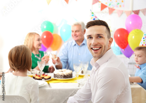 Family celebrating birthday at home