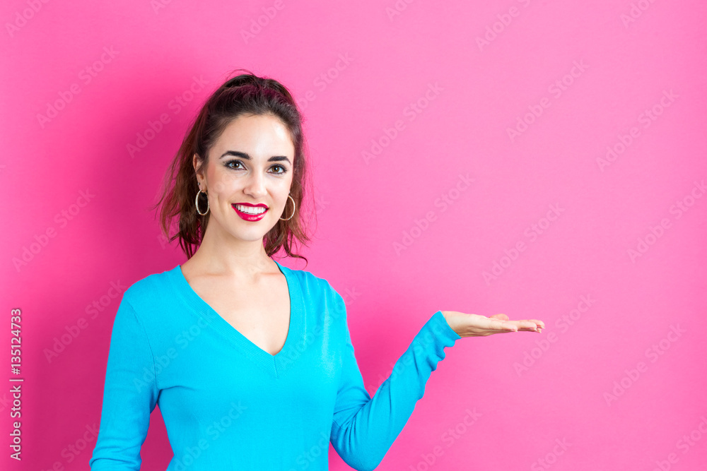Young woman with a displaying hand gesture Young woman with a displaying hand gesture