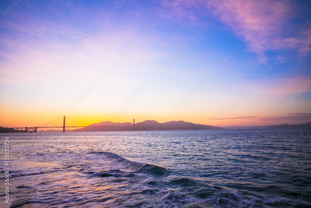 Sunset at the Famous Golden Gate Bridge, San Francisco, California, USA.  View from Crissy Field of Waves.
