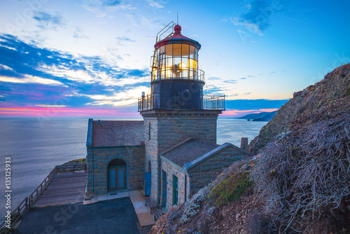 Point Sur Lighthouse in Big Sur, California, USA at Sunset photo