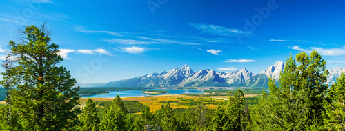 Grand Teton National Park, Wyoming.  Grand Tetons Mountain Range. Blue Sky.  Panorama photo