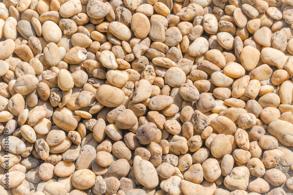 Small beige color round stone gravel background texture. rocky, stony pebbles. Small beige color round stone gravel background texture. rocky, stony pebbles.