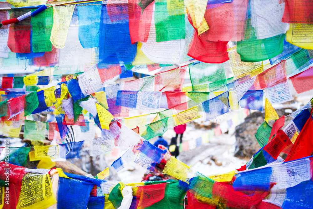 color prayer flags on top of Annapurna base camp