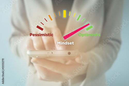 Businesswoman using smartphone with meter indicator :Optimistic