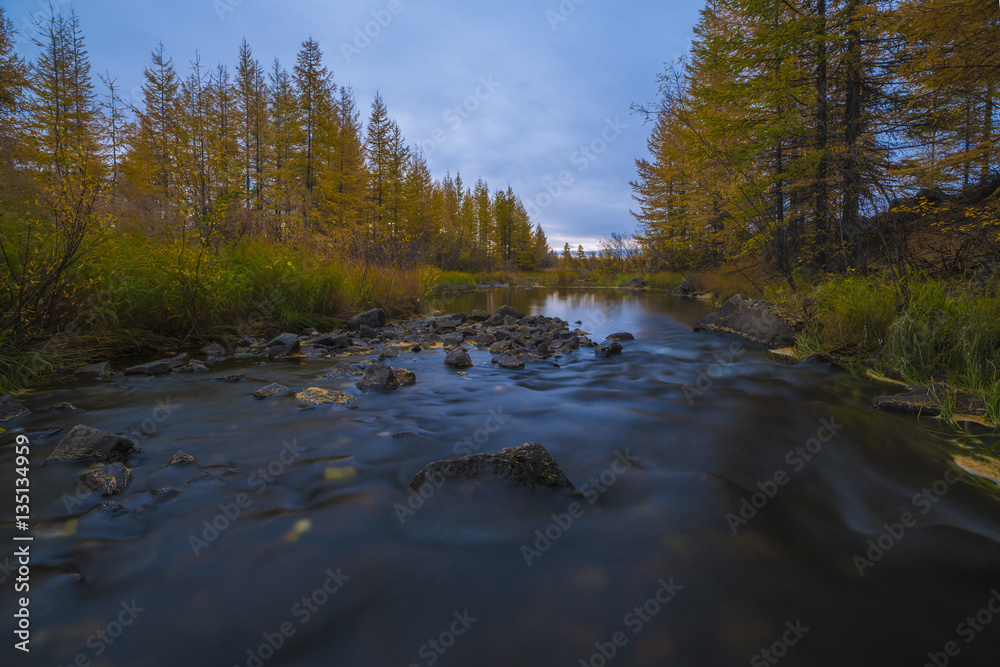 Fall autumn day landscape with river, forest, clouds on the blue sky and sun. Fall autumn day landscape with river, forest, clouds on the blue sky and sun.